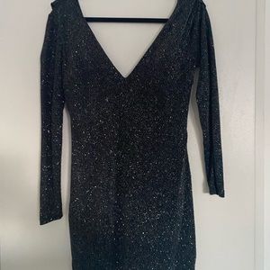 Beautiful sparkly dress. Hugs curves. Has back out. In great condition.